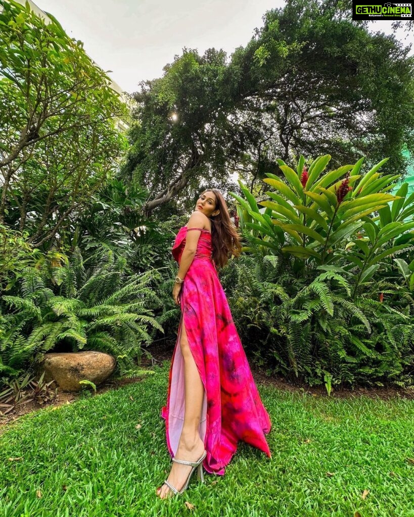 Kritika Sharma Instagram - When you want to turn heads! Outfit @siseraa_ Styled by @the_neerajpandey Earrings @trazenie Location @cinnamongrandcolombo #travel #srilanka #gown #girl #model #indian #howtoposeingown #redgown Cinnamon Grand Colombo