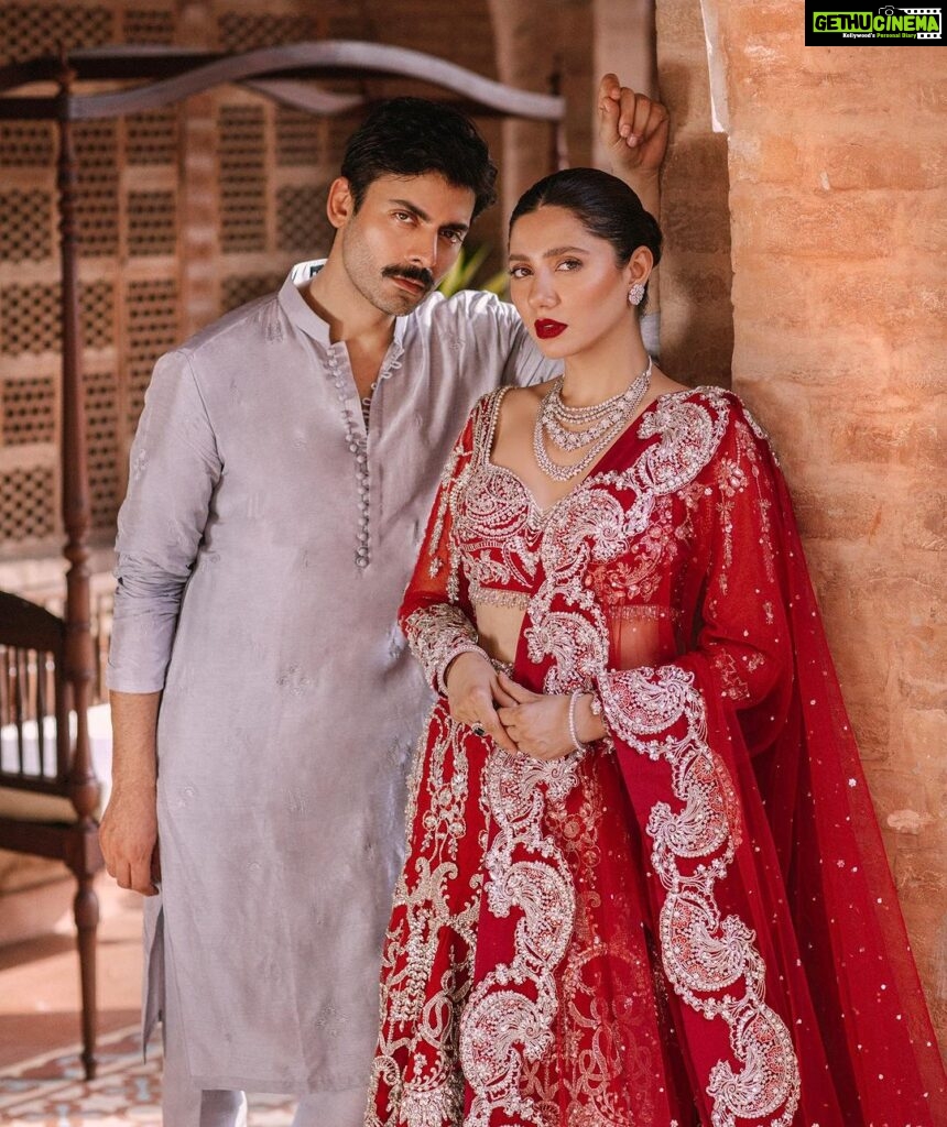 Mahira Khan Instagram - Mahirah Khan & Fawad Khan bring to life , our vision for the latest Bridal Couture collection ‘23 , Phir Milenge ! The elegance of this collection intends to capture the essence of the brands design ethos - Refined and exclusive. At Sadaf Fawad Khan Studio , we enjoy the challenge to achieve a balance between preserving age old cultural traditions and complimenting our modern day sensibilities. We hope you will enjoy this beautiful collection that has been captured by the dreamy lens of @abdullahharisfilms Hair & Makeup ( Fawad Khan ) - @shammalq Hair & Makeup ( Mahirah Khan ) - @fatimanasirofficial Jewllery : @farhatalijewellers Styling : @fazeel_anser , @sadaffawadkhan Set Art : @mahinareki , @khizer.durrani Camerawork : @talhaa_sharjeel #sfkbridals #sfkstudio #hazureonline #fawadkhan #mahirakhan #sadaffawadkhan