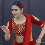 Meenakshi Dixit Instagram - My love for evergreen retro songs ❤️ Just felt like posting this one 🎶🫶😇 #zhumkagirare #meenakshidixit #red #lehenga #mydesign #mystyle #reels #reelsinstagram #reelitfeelit #instagramreels #love #instagood #trendingreels #trending #trendingsongs