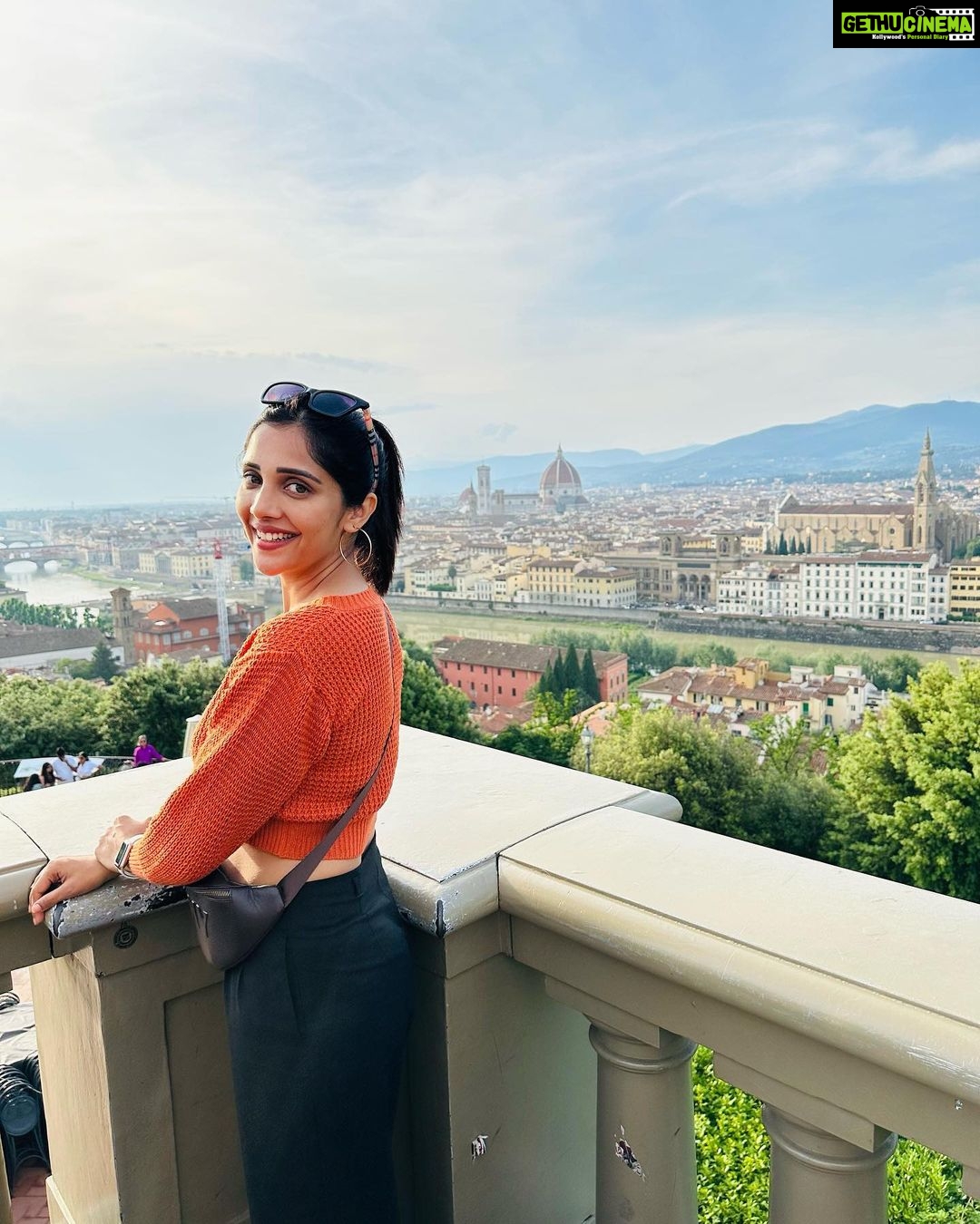 Milana Nagaraj Instagram - A day in Florence🧡 1. In the streets of Florence 2. City view from Piazzale Michelangelo 3. Tired, wondering what to eat😜 4. Pitti Palace 5. Selfie with darling! 6. Stunning View of Florence from Giottos bell tower 7. Basilica of Santha Croce #italy #florence #travel2023 #milananagaraj Florence, Italy