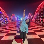 Misha Ghoshal Instagram - The inner child in me got way too excited seeing this bridge 🥺❤️ pure love and joy #colors #lighting #nightlife #chennai #bridge #marinabeach Napier Bridge, Marina Beach , Chennai