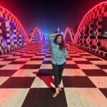 Misha Ghoshal Instagram - The inner child in me got way too excited seeing this bridge 🥺❤️ pure love and joy #colors #lighting #nightlife #chennai #bridge #marinabeach Napier Bridge, Marina Beach , Chennai