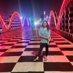 Misha Ghoshal Instagram - The inner child in me got way too excited seeing this bridge 🥺❤️ pure love and joy #colors #lighting #nightlife #chennai #bridge #marinabeach Napier Bridge, Marina Beach , Chennai