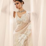 Mouni Roy Instagram - My front row cliché 🤍 #ASareeGirlForever • • • Dressed in @rohitbalofficial Jewels @anmoljewellers Rings @narayanjewels Styled by @manekaharisinghani Hair by @hairbysharda Make up by @chettiaralbert Shot by @trishasarang