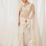 Mouni Roy Instagram - My front row cliché 🤍 #ASareeGirlForever • • • Dressed in @rohitbalofficial Jewels @anmoljewellers Rings @narayanjewels Styled by @manekaharisinghani Hair by @hairbysharda Make up by @chettiaralbert Shot by @trishasarang