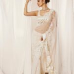 Mouni Roy Instagram - My front row cliché 🤍 #ASareeGirlForever • • • Dressed in @rohitbalofficial Jewels @anmoljewellers Rings @narayanjewels Styled by @manekaharisinghani Hair by @hairbysharda Make up by @chettiaralbert Shot by @trishasarang