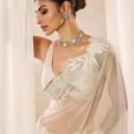 Mouni Roy Instagram - My front row cliché 🤍 #ASareeGirlForever • • • Dressed in @rohitbalofficial Jewels @anmoljewellers Rings @narayanjewels Styled by @manekaharisinghani Hair by @hairbysharda Make up by @chettiaralbert Shot by @trishasarang