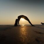 Nikita Dutta Instagram - Wearing gratitude and taking some light from the setting sun. 🌅 🌊 🧘‍♀️ 🌸 . . . . . #Sunset #Yoga #ChakraAsana #BackBends #wheelposevariation #UtthitaHastaPadangusthasana #YogaByTheBeach #Stretch #Photography Palshet Beach