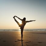Nikita Dutta Instagram - Wearing gratitude and taking some light from the setting sun. 🌅 🌊 🧘‍♀️ 🌸 . . . . . #Sunset #Yoga #ChakraAsana #BackBends #wheelposevariation #UtthitaHastaPadangusthasana #YogaByTheBeach #Stretch #Photography Palshet Beach