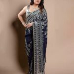 Ramya Krishnan Instagram - #bbjodigal2 #grandfinale @disneyplushotstartamil @disneyplushotstar Styled by @jukalker Wearing this midnight blue saree by @manishmalhotraworld Jewellery by @jaipurgems Shot by @kiransaphotography Mua @artistrybyolivia Hair @manohar_hair