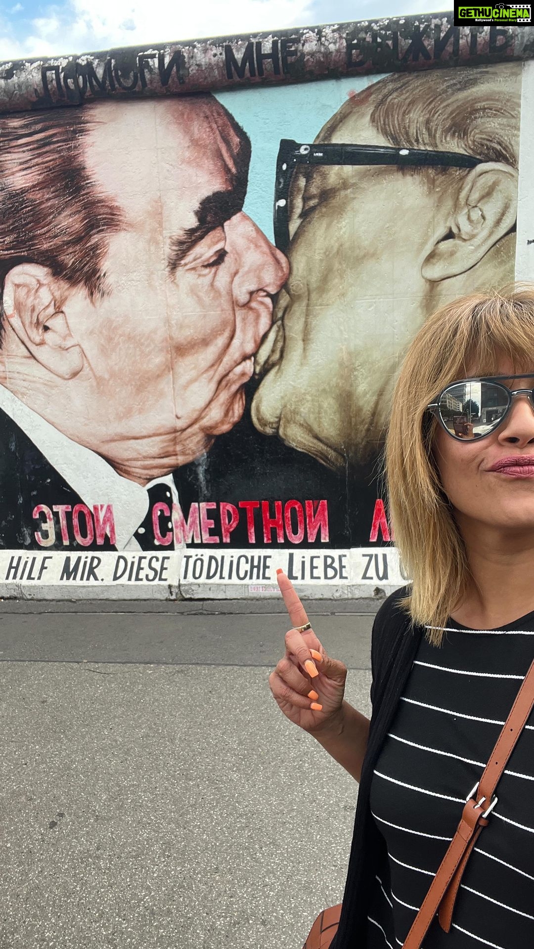 Ranjini Haridas Instagram - The Berlin Wall - Possibly the most iconic image of the Cold War in Europe . For many years, the Berlin Wall separated East Germany from West Germany, acting as a physical barrier that symbolised the political divisions of the time. It was a symbol of the Iron Curtain, and its destruction marked the end of communist power in Germany. East Side Gallery : At 1316 metres long, the open-air art gallery on the banks of the Spree in Friedrichshain is the longest continuous section of the Berlin Wall still in existence. Immediately after the wall came down, 118 artists from 21 countries began painting the East Side Gallery, and it officially opened as an open air gallery on 28 September 1990. Just over a year later, it was given protected memorial status. #incaseyoulikehistory #whenartmeethistory #anotherbrickinthewall #berlin #eastsidegallery #germany #coldwar #artists #dedicatedreel #art #ranjiniraghavan