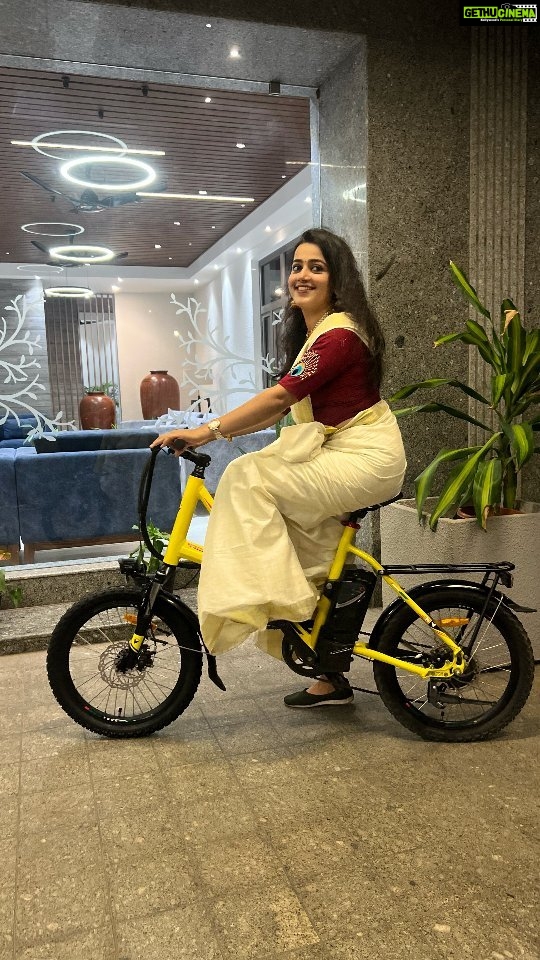 Samskruthy Shenoy Instagram - "Hello, lovely souls! This Onam, I had a remarkable surprise – Vaan Electric bicycle! 🎁✨ It's not just a gift, but a whole new adventure. From the lightweight portable battery to the compact frame size, and the flexibility of 3 travel modes, it's been an absolute joy. And guess what? There's a fantastic 10k discount offer waiting for you too! Let's ride towards a greener tomorrow with Vaan Electric Cycles 🚴‍♀️💚 Get Vaan Electric bicycle on Amazon: Vaan Urbansport - https://amzn.eu/d/8WMsiBR Vaan Urbansport Pro - https://amzn.eu/d/358Ogu7 For inquiries and EMI availability, reach out at 9048122555. #vaanebikes #ebikestyle #SustainableTravel #greenliving #electricbike #HealthyLifestyle #actresslifestyle #gogreen #urbanmobility #BikeLove #fitnessjourney #OnamCelebrations #VaanAdventures #travelinspiration #WellnessJourney