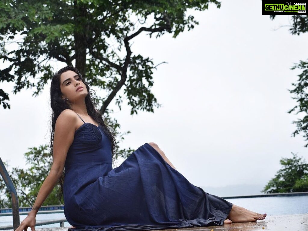 Sangeetha Bhat Instagram - “Let the rain kiss you. Let the rain beat upon your head with silver liquid drops. Let the rain sing you a lullaby.” #sangeethabhat #sangeethabhatsudarshan #monsoonbaby #rainyjuly4th #bluegown #infinitypool #naturelover #natureschild #actress #coorg #gratitude Porcupine Castle Resort, Coorg