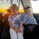Sayani Gupta Instagram – Meet Audrey & Murray. Both 97.
We met them on the Sunset cruise at Hayman. We noticed them &@smritikiran expressed how cute they were. As the 🛥️ took off I couldn’t help go say hi. And the rest is History.

So A&M went to school together since they were 4..when he would carry her books for her. They were friends.. (I asked if Murray had a crush on Audrey to which she quickly quipped & said Oh YES!) she knew he liked her and of course there was an understanding.
After school and beginning of collage Murray had to go for the War(WWll), he was in the navy. While he was away.. Audrey got married to another man. He came back after the war and married someone else too. They both had children with their respective partners. But kept in touch.Later they both lost their partners.
One day Audrey was coming out of her house and a bike came and stood in front of her. On it was a man with 🪖& 🕶️ . She couldn’t see his face & told him why he would stop in front of her this way. As he took out his helmet, he said.. ‘Audrey, you don’t recognise me? It’s Murray!’
She couldn’t believe her eyes. They rekindled their friendship. And sometime later Murray moved in with her. They started dating 6 years ago and got married one and half years ago. Now they live in her house (not his mansion) &travel together. While Murray struggles to remember things (Audrey is sharp), She struggles to walk (Murray wheels her around). It’s the perfect Companionship.

I told her how fitting her name was.. Audrey (like Hepburn)! 

She said ‘You have beautiful hair’. 
To which Murray added.. ‘Oh Darling! Just the hair! I am sitting here wondering how many marriage proposals she would get in a day!’
Audrey and I slightly choked!😂

As we spoke about other worldly things like kids & disappointments & ailments & coral reefs.. Audrey asked me if I were married & had children.. I told her I wasn’t.
So she held both my hands and said.. ‘here’s to finding Mr.Right!’ (Now from their story Mr.R may come when I am 90.. who knows). But as the Sun went down & I had made new friends.. I was reminded of how unexpectedly beautiful life turns out if you let it perhaps!

A&M is now, my fav love story. 
🤍🤍