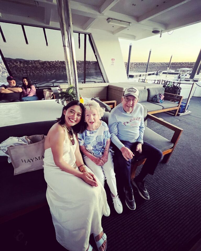 Sayani Gupta Instagram - Meet Audrey & Murray. Both 97. We met them on the Sunset cruise at Hayman. We noticed them &@smritikiran expressed how cute they were. As the 🛥️ took off I couldn’t help go say hi. And the rest is History. So A&M went to school together since they were 4..when he would carry her books for her. They were friends.. (I asked if Murray had a crush on Audrey to which she quickly quipped & said Oh YES!) she knew he liked her and of course there was an understanding. After school and beginning of collage Murray had to go for the War(WWll), he was in the navy. While he was away.. Audrey got married to another man. He came back after the war and married someone else too. They both had children with their respective partners. But kept in touch.Later they both lost their partners. One day Audrey was coming out of her house and a bike came and stood in front of her. On it was a man with 🪖& 🕶️ . She couldn’t see his face & told him why he would stop in front of her this way. As he took out his helmet, he said.. ‘Audrey, you don’t recognise me? It’s Murray!’ She couldn’t believe her eyes. They rekindled their friendship. And sometime later Murray moved in with her. They started dating 6 years ago and got married one and half years ago. Now they live in her house (not his mansion) &travel together. While Murray struggles to remember things (Audrey is sharp), She struggles to walk (Murray wheels her around). It’s the perfect Companionship. I told her how fitting her name was.. Audrey (like Hepburn)! She said ‘You have beautiful hair’. To which Murray added.. ‘Oh Darling! Just the hair! I am sitting here wondering how many marriage proposals she would get in a day!’ Audrey and I slightly choked!😂 As we spoke about other worldly things like kids & disappointments & ailments & coral reefs.. Audrey asked me if I were married & had children.. I told her I wasn’t. So she held both my hands and said.. ‘here’s to finding Mr.Right!’ (Now from their story Mr.R may come when I am 90.. who knows). But as the Sun went down & I had made new friends.. I was reminded of how unexpectedly beautiful life turns out if you let it perhaps! A&M is now, my fav love story. 🤍🤍
