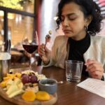 Shraddha Srinath Instagram – Azeri people are the nicest. Especially the waiters. They’ll coax you into ordering two bottles of wine and two desserts too, flashing their best smiles and speaking in their best broken English. But no one ever complained of having too much wine or dessert right? Don’t answer that. Ate an excellent Azeri meal and Russian meal. So many beautiful restaurants! Cats. Soooooo many cats. Some friendly, some unbothered. I guess those are the only two categories of cats there are. The outskirts of Baku looks very soviet and cold, but you enter the city and it is so full of life and so charming. Lovely large parks, coffee shops, huge promenade, cobbled roads and sidewalks. Cops everywhere and I mean EVERYWHERE, and so helpful too. Our driver to Gabala fought the Azerbaijan-Armenia war 2 years ago and proudly showed off his medals and certificates. Azerbaijani men have to undergo compulsory military training after the age of 18 it seems. Anyway. I played music off my phone on our way back to the hotel and between ‘dil ko tumse pyar hua’ and ‘Ondra renda asaigal’ he loved the latter. His verdict, not mine. Also saw parts of the Baku street circuit. My airport taxi guy asked if I knew Azerbaijani and when I said no he wanted to chat with me using google translate while zipping on the highway. No thanks, I said in English. I think he understood. 

The second photo is my reaction to blue cheese. You should know how I react to blue cheese. 
F1 fans do you recognise the turn in the 3rd photo???? Can’t wait for the season to beginnnnn. 

Photos by @rohitsabu