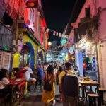 Shraddha Srinath Instagram – Went to an amusement park after what felt like a a hundred years. Jolly. Went on the Mummy ride and screamed out “MUMMMYYYYY” and instantly realised the humour in it. Went for a very nice Peranakan cuisine dinner. Exquisite. Ate so much street food. Tried a bite of durian mousse too. I’ve now joined the anti durian forces. Went for three days of the grand prix. Unforgettable. It was hot and a lot of beer was consumed. I forgot my sunglasses back in India so I had to buy an overpriced merch cap and picked the F1 logo cap because that’s as non committal as it gets. Hey, I’m here for the sport. A girl is allowed to take her time to pick a team no? I want to marry @danielricciardo though. The stories of my love for him are famous. There was beer on the rainy days too, did I mention? Speaking of the rain, the devil himself descended upon us in the form of torrential rains ooooffff. Everyone was wearing white shoes and everyone went home weeping. People were falling all over the place thanks to the slush. I WATCHED @westlife LIVE! Those who do not share my enthusiasm for Westlife can please go stand in one corner. Teenage Shraddha is beaming. I watched the Black eyed peas too but Westlife is what made me so happy. The last picture of me standing under that warning sign is so funny. I laughed and laughed and laughed. Sunscreen was worn on all the days. This is my Singapore dump. Thank you for reading this far.