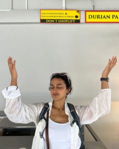 Shraddha Srinath Instagram - Went to an amusement park after what felt like a a hundred years. Jolly. Went on the Mummy ride and screamed out "MUMMMYYYYY” and instantly realised the humour in it. Went for a very nice Peranakan cuisine dinner. Exquisite. Ate so much street food. Tried a bite of durian mousse too. I've now joined the anti durian forces. Went for three days of the grand prix. Unforgettable. It was hot and a lot of beer was consumed. I forgot my sunglasses back in India so I had to buy an overpriced merch cap and picked the F1 logo cap because that's as non committal as it gets. Hey, I'm here for the sport. A girl is allowed to take her time to pick a team no? I want to marry @danielricciardo though. The stories of my love for him are famous. There was beer on the rainy days too, did I mention? Speaking of the rain, the devil himself descended upon us in the form of torrential rains ooooffff. Everyone was wearing white shoes and everyone went home weeping. People were falling all over the place thanks to the slush. I WATCHED @westlife LIVE! Those who do not share my enthusiasm for Westlife can please go stand in one corner. Teenage Shraddha is beaming. I watched the Black eyed peas too but Westlife is what made me so happy. The last picture of me standing under that warning sign is so funny. I laughed and laughed and laughed. Sunscreen was worn on all the days. This is my Singapore dump. Thank you for reading this far.