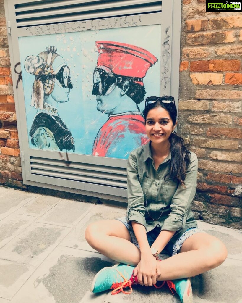 Swathi Reddy Instagram - Venice is a like a good looking person you meet whose grammar is on point. Who is proper and pretty on the outside. So you look for more hidden gems underneath the surface and you do find some but you can’t shake off a feeling of emptiness while walking away. Like nothing. Like my fake smile here. The irony of the picture behind. Sorry, Venice. Venice, Italy