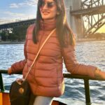 Vimala Raman Instagram - When the magic hour fills my soul ☀️⛅️⛴️🧡 . . . . #instareels #reelitfeelit #reels #travel #sydney #australia #harbourbridge #cruise #waters #goldenhour #golden #home #winter #sunset #love #actor #actress #vimalaraman #lifeisbeautiful