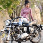Aditi Prabhudeva Instagram - 😜Not only for boys but a bike is also crush for many girls too 🏍 . . #throwback #bikelove #champion Designer: @laxmikrishnaofficial
