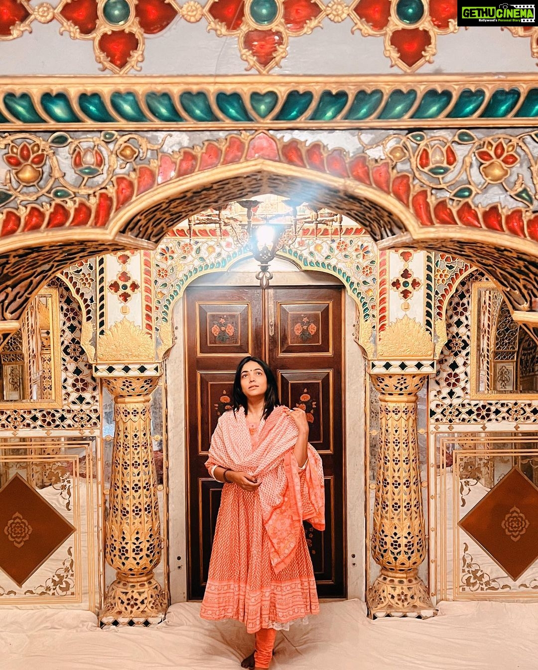 Anupama Gowda Instagram - Jaipur 🌸 1. City palace Every inch of this palace is mesmerising 💓 Love it Love it Love it ! Made of red and pink sandstone , antique artwork and intricate details. To this day, City palace is home to the present royal family of Jaipur. I took City palace Royal tour (3,000/- per person ) where I got the access to visit the upper floors of Chandra Mahal with private guide and in the end complimentary Chai with cookies. 1st floor - Maharaja Sawai Man Singh || Museum. 2nd floor - Sukh Niwas / Blue room. 3rd and 4th floors - Mirror Room and Shobha Niwas. 2. Patrika Gate One of the beautiful locations of Jaipur,it was built to showcase the architectural and cultural heritage of all the regions of Rajasthan. It will be crowded after 10:30 so plan to visit this place around 9 to get some amazing pictures and to enjoy the view. (No entry fees) #travelwithnu💗 Travelling partner: @zipntrip_travel_solutions PC : My tour guide Mr. Rajvendrisingh 🙏🏻 PS: Who clicks your pictures when you go on a solo?? Well, I shamelessly ask everyone to click my pictures and this time I did click few pictures with them too , so swipe left to see my photographer 🤷🏻♀️ jaipur,rajesthan