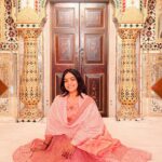 Anupama Gowda Instagram - Jaipur 🌸 1. City palace Every inch of this palace is mesmerising 💓 Love it Love it Love it ! Made of red and pink sandstone , antique artwork and intricate details. To this day, City palace is home to the present royal family of Jaipur. I took City palace Royal tour (3,000/- per person ) where I got the access to visit the upper floors of Chandra Mahal with private guide and in the end complimentary Chai with cookies. 1st floor - Maharaja Sawai Man Singh || Museum. 2nd floor - Sukh Niwas / Blue room. 3rd and 4th floors - Mirror Room and Shobha Niwas. 2. Patrika Gate One of the beautiful locations of Jaipur,it was built to showcase the architectural and cultural heritage of all the regions of Rajasthan. It will be crowded after 10:30 so plan to visit this place around 9 to get some amazing pictures and to enjoy the view. (No entry fees) #travelwithnu💗 Travelling partner: @zipntrip_travel_solutions PC : My tour guide Mr. Rajvendrisingh 🙏🏻 PS: Who clicks your pictures when you go on a solo?? Well, I shamelessly ask everyone to click my pictures and this time I did click few pictures with them too , so swipe left to see my photographer 🤷🏻‍♀️ jaipur,rajesthan