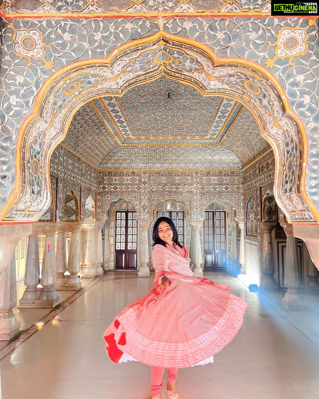 Anupama Gowda Instagram - Jaipur 🌸 1. City palace Every inch of this palace is mesmerising 💓 Love it Love it Love it ! Made of red and pink sandstone , antique artwork and intricate details. To this day, City palace is home to the present royal family of Jaipur. I took City palace Royal tour (3,000/- per person ) where I got the access to visit the upper floors of Chandra Mahal with private guide and in the end complimentary Chai with cookies. 1st floor - Maharaja Sawai Man Singh || Museum. 2nd floor - Sukh Niwas / Blue room. 3rd and 4th floors - Mirror Room and Shobha Niwas. 2. Patrika Gate One of the beautiful locations of Jaipur,it was built to showcase the architectural and cultural heritage of all the regions of Rajasthan. It will be crowded after 10:30 so plan to visit this place around 9 to get some amazing pictures and to enjoy the view. (No entry fees) #travelwithnu💗 Travelling partner: @zipntrip_travel_solutions PC : My tour guide Mr. Rajvendrisingh 🙏🏻 PS: Who clicks your pictures when you go on a solo?? Well, I shamelessly ask everyone to click my pictures and this time I did click few pictures with them too , so swipe left to see my photographer 🤷🏻♀️ jaipur,rajesthan