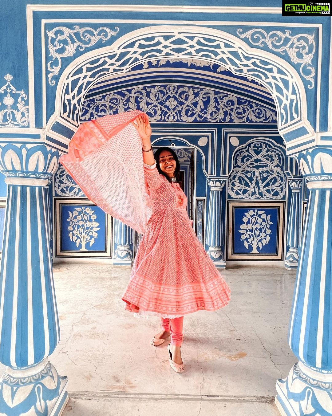 Anupama Gowda Instagram - Jaipur 🌸 1. City palace Every inch of this palace is mesmerising 💓 Love it Love it Love it ! Made of red and pink sandstone , antique artwork and intricate details. To this day, City palace is home to the present royal family of Jaipur. I took City palace Royal tour (3,000/- per person ) where I got the access to visit the upper floors of Chandra Mahal with private guide and in the end complimentary Chai with cookies. 1st floor - Maharaja Sawai Man Singh || Museum. 2nd floor - Sukh Niwas / Blue room. 3rd and 4th floors - Mirror Room and Shobha Niwas. 2. Patrika Gate One of the beautiful locations of Jaipur,it was built to showcase the architectural and cultural heritage of all the regions of Rajasthan. It will be crowded after 10:30 so plan to visit this place around 9 to get some amazing pictures and to enjoy the view. (No entry fees) #travelwithnu💗 Travelling partner: @zipntrip_travel_solutions PC : My tour guide Mr. Rajvendrisingh 🙏🏻 PS: Who clicks your pictures when you go on a solo?? Well, I shamelessly ask everyone to click my pictures and this time I did click few pictures with them too , so swipe left to see my photographer 🤷🏻♀️ jaipur,rajesthan