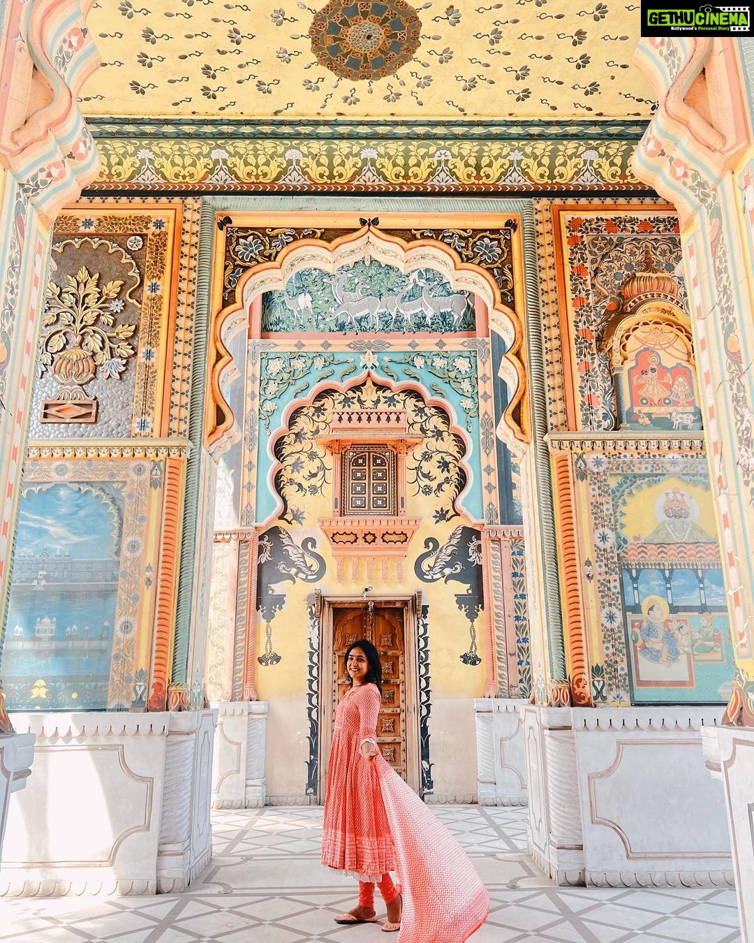 Anupama Gowda Instagram - Jaipur 🌸 1. City palace Every inch of this palace is mesmerising 💓 Love it Love it Love it ! Made of red and pink sandstone , antique artwork and intricate details. To this day, City palace is home to the present royal family of Jaipur. I took City palace Royal tour (3,000/- per person ) where I got the access to visit the upper floors of Chandra Mahal with private guide and in the end complimentary Chai with cookies. 1st floor - Maharaja Sawai Man Singh || Museum. 2nd floor - Sukh Niwas / Blue room. 3rd and 4th floors - Mirror Room and Shobha Niwas. 2. Patrika Gate One of the beautiful locations of Jaipur,it was built to showcase the architectural and cultural heritage of all the regions of Rajasthan. It will be crowded after 10:30 so plan to visit this place around 9 to get some amazing pictures and to enjoy the view. (No entry fees) #travelwithnu💗 Travelling partner: @zipntrip_travel_solutions PC : My tour guide Mr. Rajvendrisingh 🙏🏻 PS: Who clicks your pictures when you go on a solo?? Well, I shamelessly ask everyone to click my pictures and this time I did click few pictures with them too , so swipe left to see my photographer 🤷🏻♀️ jaipur,rajesthan