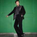 Avinash Tiwary Instagram - Room of shadows and dim light, A man in black, with eyes so bright, Wore his suit, tailored to perfection, Her little black dress, a reflection… In shadows deep, they both confess, His eyes on her, a slow undress, Her curves, a smile, a sigh, a breath, A taste of saliva, a hint of death. A pinch of desire, a playful slap, In whispered secrets, they entrap, In black attire, a game they play, With just a look, they've found their way. Outfit - @sarabkhanijouofficial Style by - @who_wore_what_when Photography - @mohitvaru Makeup - @esther_hmu Hairstylist - @anshul_hair
