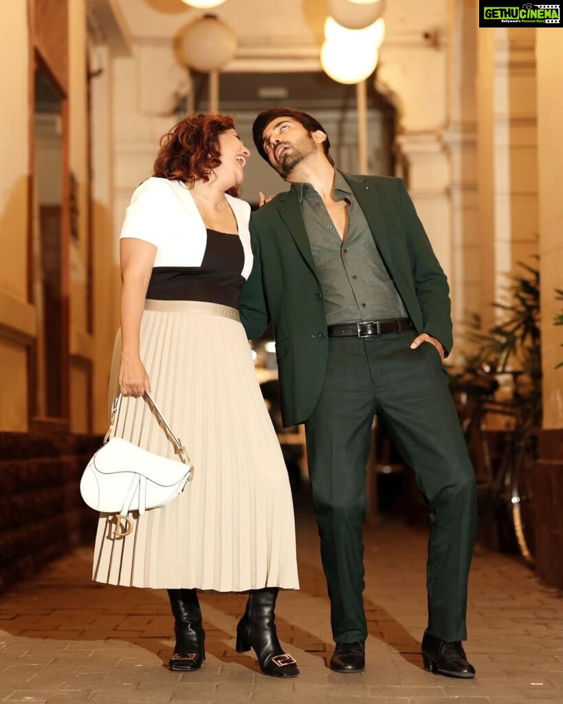 Debina Bonnerjee Instagram - The last one is our wholesome mood 😂🫶🏻😛 #swipe . Black and White Outfit - @calvinklein Pleated skirt - @tommyhilfiger Bag - @dior Shoes - @versace Gurmeet’s Outfit - Monochrome blazer, shirt and trousers - @tommyhilfiger Fashion Directed by: @thebongmunda 📸 : @sk_.click Managed by : @jeevitaoberoi