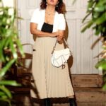 Debina Bonnerjee Instagram - 🖤🤎🤍 . Black and White Outfit - @calvinklein Pleated skirt - @tommyhilfiger Bag - @dior Shoes - @versace Fashion Directed by: @thebongmunda 📸 : @sk_.click Managed by : @jeevitaoberoi . . #fashion #lifestyle #debina #debinabonnerjee #debinadecodes