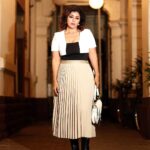 Debina Bonnerjee Instagram - 🖤🤎🤍 . Black and White Outfit - @calvinklein Pleated skirt - @tommyhilfiger Bag - @dior Shoes - @versace Fashion Directed by: @thebongmunda 📸 : @sk_.click Managed by : @jeevitaoberoi . . #fashion #lifestyle #debina #debinabonnerjee #debinadecodes