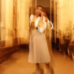 Debina Bonnerjee Instagram - Life is a beautiful blur 🤎🖤 . Black and White Outfit - @calvinklein Pleated skirt - @tommyhilfiger Bag - @dior shoes - @versace Fashion Directed by: @thebongmunda 📸 : @sk_.click Managed by : @jeevitaoberoi