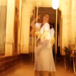 Debina Bonnerjee Instagram - Life is a beautiful blur 🤎🖤 . Black and White Outfit - @calvinklein Pleated skirt - @tommyhilfiger Bag - @dior shoes - @versace Fashion Directed by: @thebongmunda 📸 : @sk_.click Managed by : @jeevitaoberoi