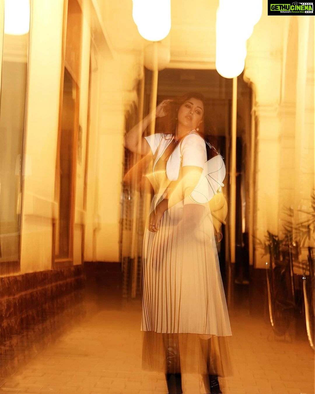 Debina Bonnerjee Instagram - Life is a beautiful blur š¤š¤ . Black and White Outfit - @calvinklein Pleated skirt - @tommyhilfiger Bag - @dior shoes - @versace Fashion Directed by: @thebongmunda šø : @sk_.click Managed by : @jeevitaoberoi
