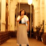 Debina Bonnerjee Instagram - Life is a beautiful blur 🤎🖤 . Black and White Outfit - @calvinklein Pleated skirt - @tommyhilfiger Bag - @dior shoes - @versace Fashion Directed by: @thebongmunda 📸 : @sk_.click Managed by : @jeevitaoberoi