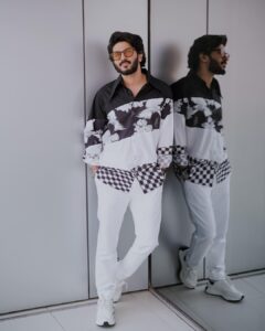 Dulquer Salmaan Instagram - 1 day to go.. can’t wait to see you all in Cinemas worldwide ! 

#KingOfKotha 

Styled by @harmann_kaur_2.0 
Style team @anokha_ann @poojakaranam @neharathi_ 
Outfit @twopointtwostudio
Make up @av_ratheeshcinema
Hairstylist @saurabhbhatkar
Photographer @sbk_shuhaib