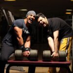 John Abraham Instagram – Gym time with John Abraham: Lifting, laughing, and living it up! 💪😍

 #btswithdabboo with My Powerlifting Pal John! 🩵 @thejohnabraham 
@dabbooratnani 

📸 @manishadratnani 

@dabbooratnanistudio
#dabbooratnani #johnabraham #dabbooratnanicalendar #dabbooratnaniphotography Dabboo Ratnani Photography