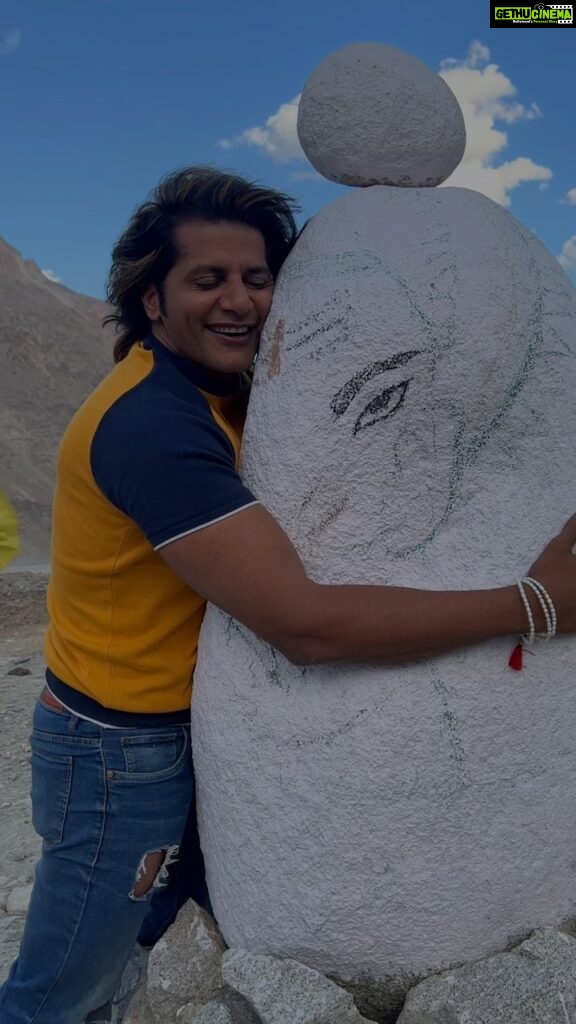 Karanvir Bohra Instagram - ganesha blessed me on the eve of #ganeshchaturti In #ladakh on the way to #pangong someone painted this rock and gave it a shape of #lordganesha It was so overwhelming, I didn’t leave ganesha for 10 minutes, just kept hugging… Thank you @wangchukstany for this opportunity to visit ladakh… @wisdomhimalayanvoyages @utladakhtourism #ladakhtourism Thank you for the wonderful idea @_kushalchauhan #Travel #Wanderlust #Explore #Adventure #travelgram #TravelPhotography #BeautifulDestinations #BucketList #TravelDiaries #TravelGoals #NatureLovers #RoamTheWorld #VacationMode #TravelAddict #ExploreMore #AdventureAwaits #WorldTraveler
