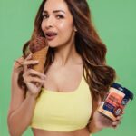 Malaika Arora Instagram - This is @malaikaaroraofficial’s world and we’re just living in it watching her bite into our high protein, healthy chocolate brownie fudge ice cream 😌😌 #GetAWay #healthydesserts #NotGuilty #GAWxMalaika #guiltfreeindulgence #proteinicecreams #sharktankindia