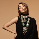 Malaika Arora Instagram – Malaika Arora lends her inherent verve and vivacity to our “high jewellery” bridal set which is a poetic cross medley of polki, diamonds, rubies and emeralds. An homage to the heritage architecture, its double strands, maximalist settings and imposing pendants make it an extraordinary collectible!

@malaikaaroraofficial 
@longformgram 
Photography : @taras84 
Styling : @manekaharisinghani 
Makeup : @mallika_bhat 
Hair : @hairstylist_madhav2.0 
Production : @ikp.insta 

#malaikaaroraxkhannajewellers #KhannaJEwellers #khannajewellerskj #IndiaModern #IndianJewellery #AweInspiring #ContemporaryDesign