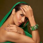 Malaika Arora Instagram – Our high jewellery bracelet seen on Malaika Arora celebrates the dramatic union of emeralds and rubies that are artfully cut to fit the design with polki and brilliant-cut diamonds as accents. Classic, contemporary and chic at the same time. 
@malaikaaroraofficial 
@longformgram 
Photography : @taras84 
Styling : @manekaharisinghani 
Makeup : @mallika_bhat 
Hair : @hairstylist_madhav2.0 
Production: @ikp.insta 

#malaikaaroraxkhannajewellers #KhannaJewellers #khannajewellerskj #IndiaModern #IndianJewellery #AweInspiring #ContemporaryDesign #HighJewellery #IndianJewelleryDesign