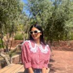 Malavika Mohanan Instagram – In in a very rainy mumbai at the moment, and reminiscing about this lovely afternoon I spent in the High Atlas hills of Morocco. There was brisk mountain air, the most orangey oranges I’ve seen & the cutest little doggo for company 🐶 As you can evidently guess, it was a good day ♥️

Also, wearing the cutest little top by @springorigin which designs the cutest stuff everrrrr
How you do this @apurvanayal howw 🤍