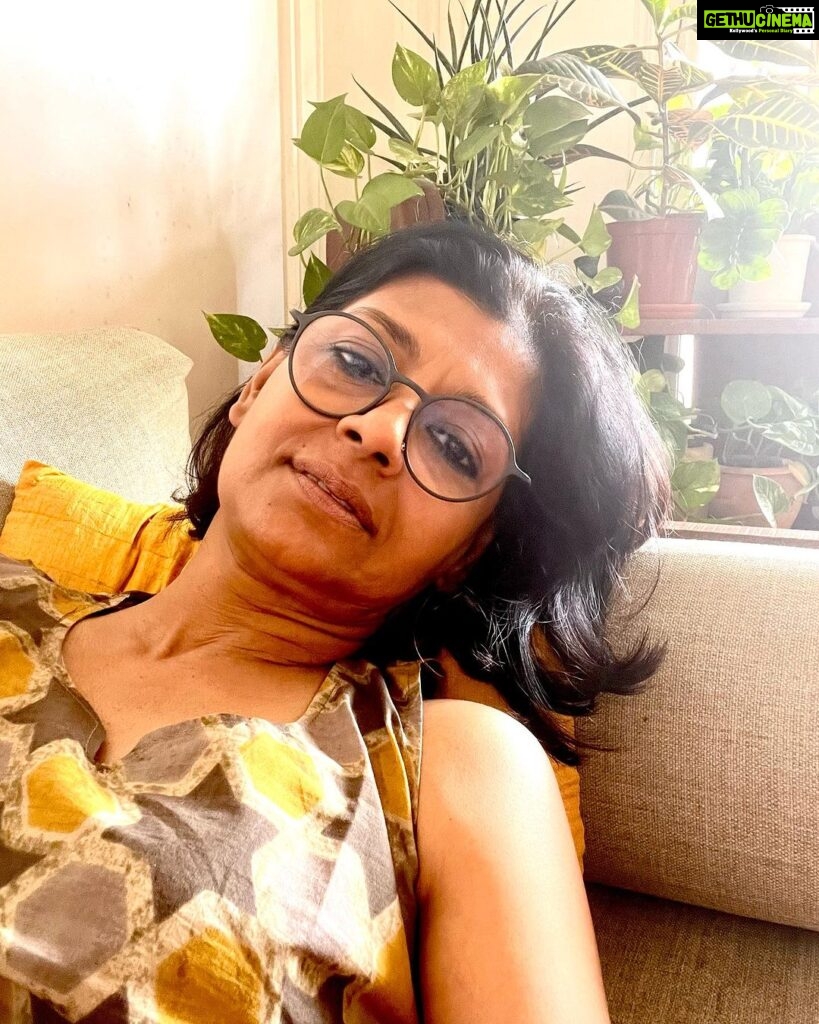 Nandita Das Instagram - Under the weather. Cluttered mind. One of those days when you are so overwhelmed with work that you want to do nothing. On top of that it’s a Monday. Potentially it could be a Sunday if I wanted, but the way the work has piled up, Sundays better look like Mondays. Today my couch is my work space, lazy space, reflective space. I have been sitting around looking at the happy plants, the unread books, the yellow flowers brought by a dear sister like friend and the ceramic bird that’s staring at me from the corner of her eyes. The hand fans, dhokra figurines, lacquer toys from my father’s collection of crafts quietly give me company…all things have found their own little corner in the living room. The weather is adding to this homey feeling. What’s your advice to pull myself out and work?