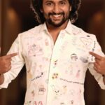 Neeraja Kona Instagram - This one was special❤️ I wanted to incorporate something personal and unique into most of the looks for Nani as part of his promotion looks for Dasara. And anyone who knows Nani knows his love for kids and that’s how this shirt came into being. I have long been associated with the wonderful team of V Care and the kids they take care of. The kids are big fans of “Nani Anna” and they were so excited to draw and write wishes for their fav hero. Once that was done my very dear friend Varun Chakillam helped me bring it to life at his studio with his amazing kaarigars. And all of this was so beautifully captured by the talented boys at Chaibiskit :) The shirt and that evening- were both very memorable for all of us involved! @nameisnani :) #Dasara @vcare_ngo @varunchakkilam Thank u 😊 @chaibisket Video Editors - @harish_adapaka @vamsinotpaidipally DOP - @nikhil_sai_s Photo Editor - @mr_baatasari Co-ordinators - @harsha009_7, @jaswanthkoya