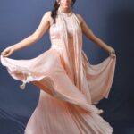 Nisha Bano Instagram – Dusty rose high neck low length flared culle sleeveless with pleats gown
Place your orders now