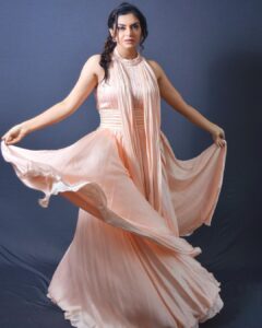 Nisha Bano Instagram - Dusty rose high neck low length flared culle sleeveless with pleats gown
Place your orders now