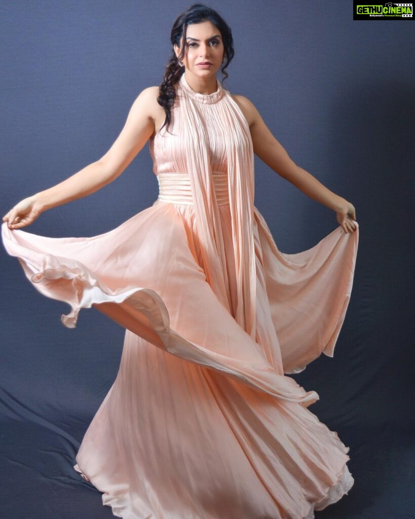 Nisha Bano Instagram - Dusty rose high neck low length flared culle sleeveless with pleats gown Place your orders now
